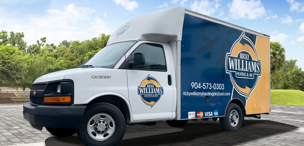 White and blue service truck for Ricky Williams Heating and Air Conditioning with logo and contact information.