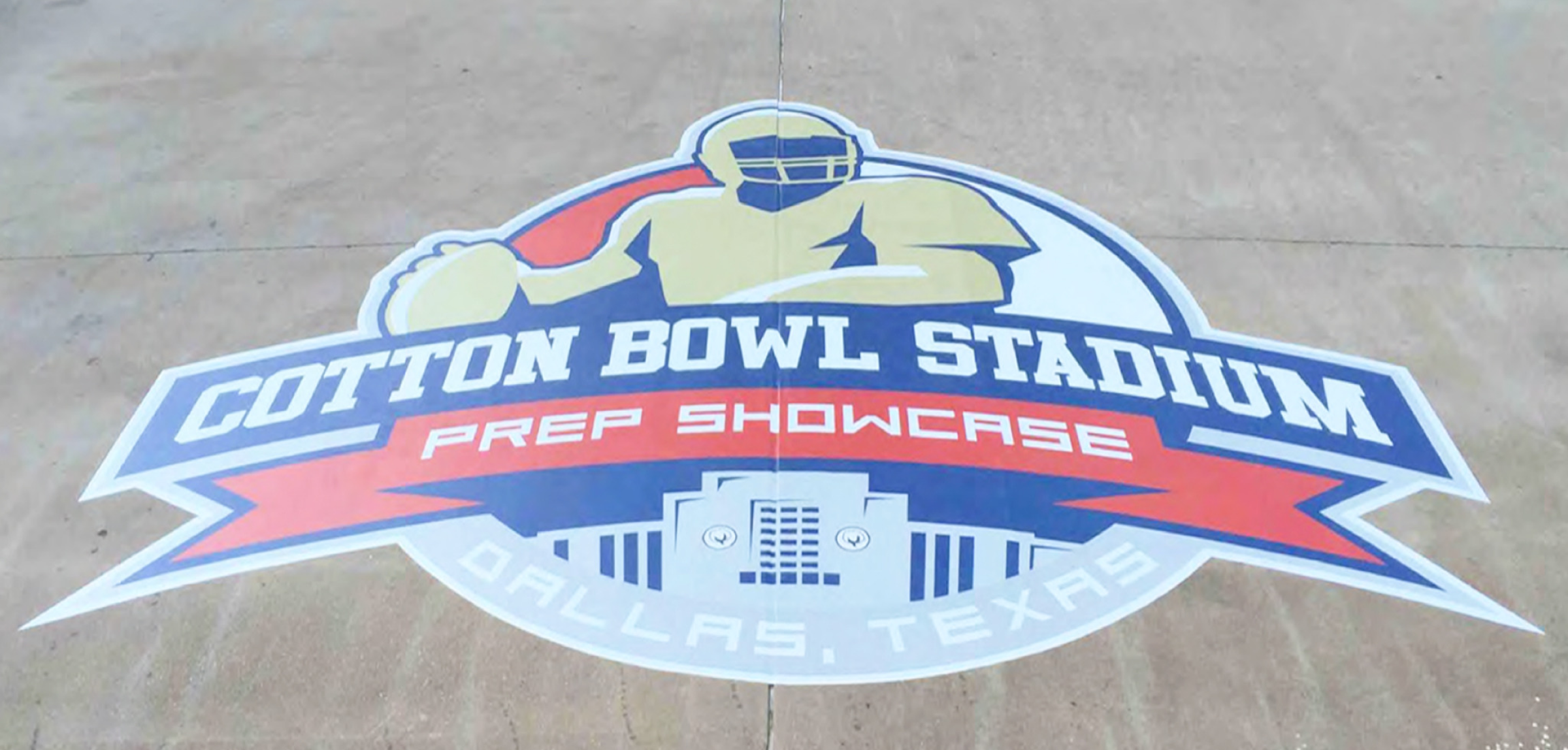Logo of Cotton Bowl Stadium Prep Showcase displayed on the ground in Dallas, Texas.