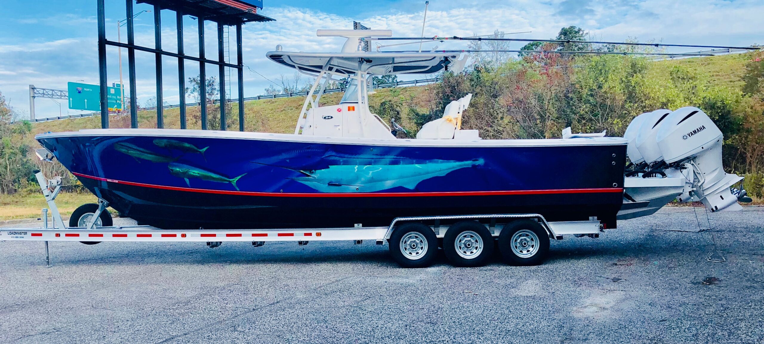 Long Regulator fishing boat with a full deep sea themed boat wrap design. Professional "Regulator" design wrapped, by Wraps Direct located in Jacksonville, FL