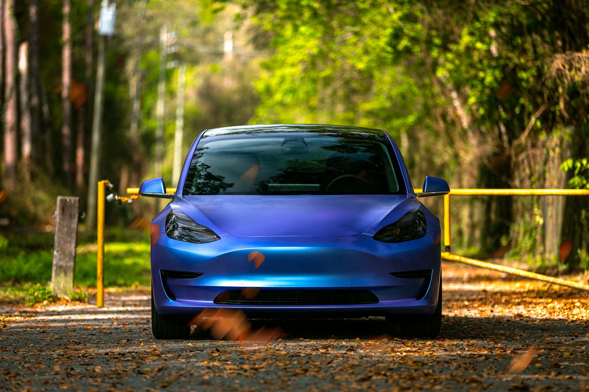 Front end of a Tesla car model wrapped in a color shifting blue satin chrome colored vinyl car wrap. A Tesla's "Satin Flip Glacial Frost" color shifting vinyl car wrap done by <a href="http://www.wrapsdirect.com">Wraps Direct</a> in Jacksonville Florida.